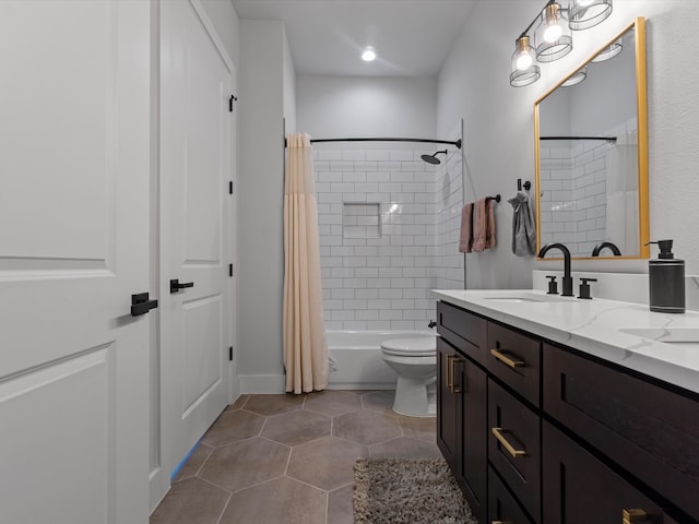 full bathroom with shower / tub combo with curtain, tile patterned floors, vanity, and toilet