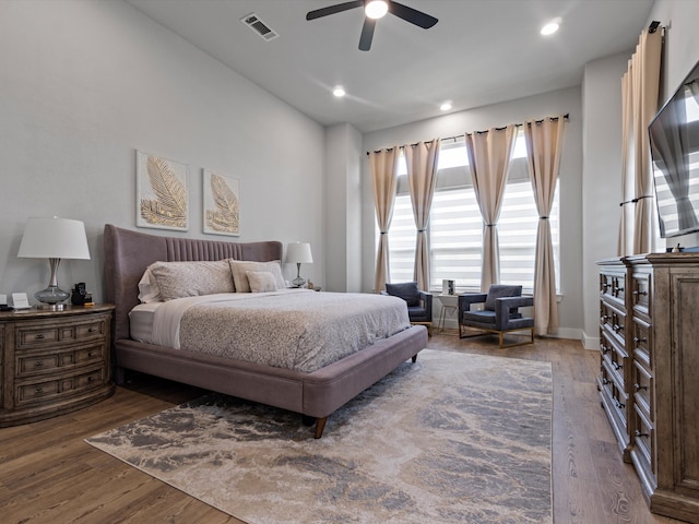 bedroom featuring ceiling fan and dark hardwood / wood-style flooring