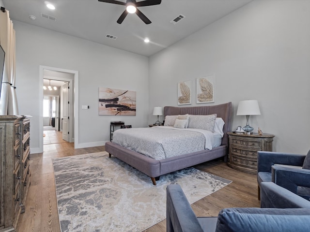 bedroom featuring ceiling fan and hardwood / wood-style flooring