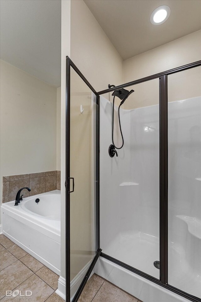 bathroom with tile patterned flooring and plus walk in shower