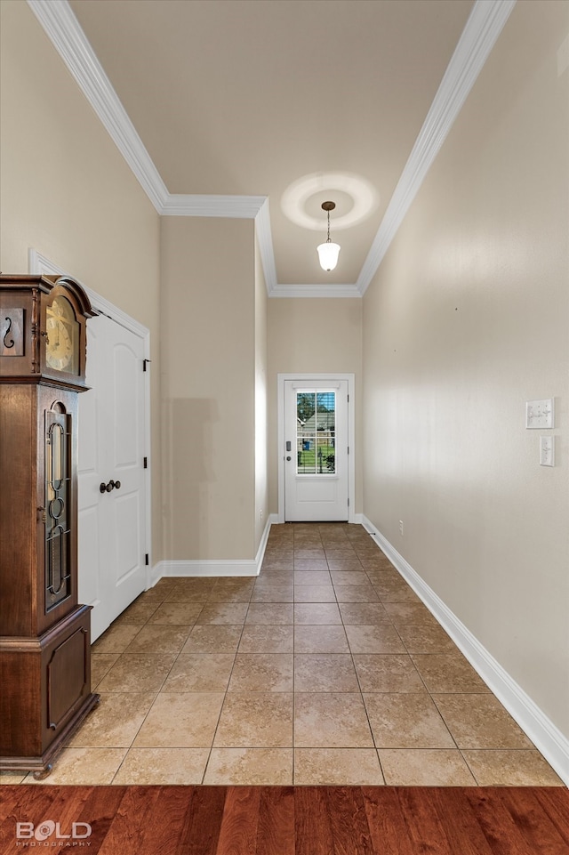 entryway featuring light wood-type flooring and ornamental molding