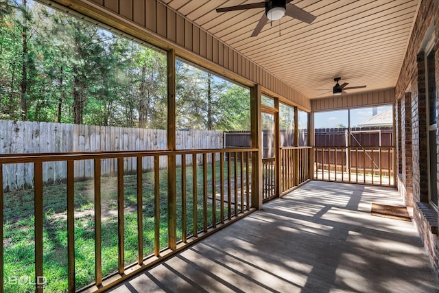 unfurnished sunroom featuring wooden ceiling