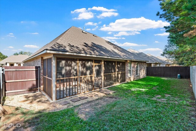 back of house featuring a yard