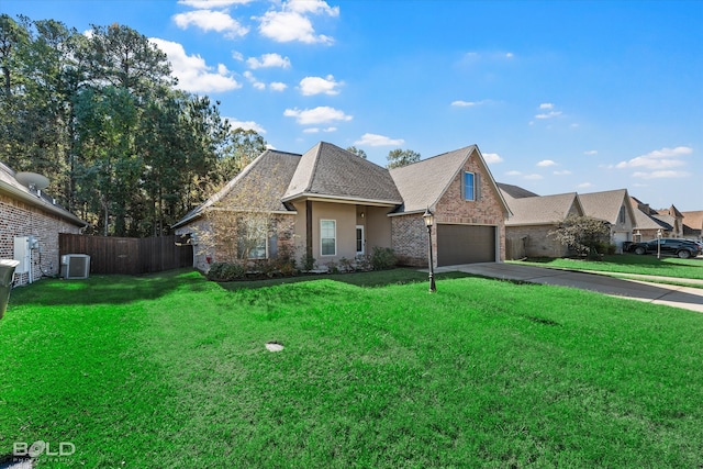 view of front of house with central AC unit and a front yard