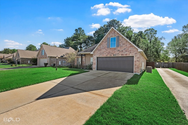 view of front property with a front yard and a garage