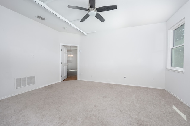 carpeted empty room with ceiling fan