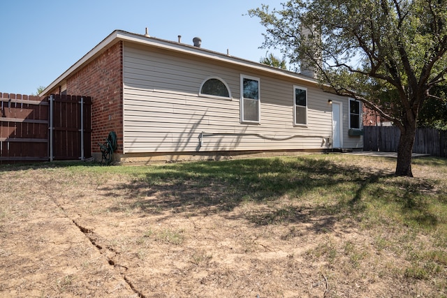 view of property exterior featuring a lawn