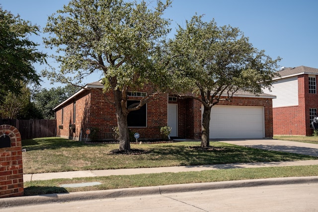 view of front of house featuring a front yard and a garage