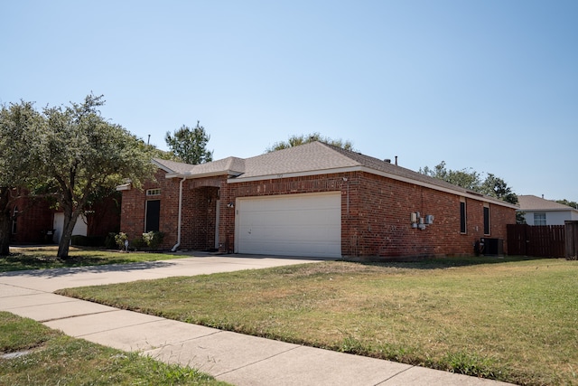 ranch-style home with a front yard, central air condition unit, and a garage