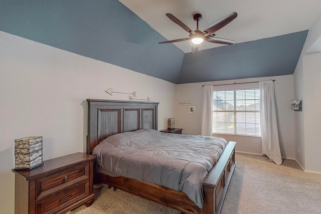 bedroom with lofted ceiling, ceiling fan, and light colored carpet