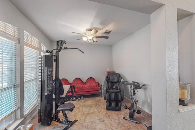 workout room featuring ceiling fan