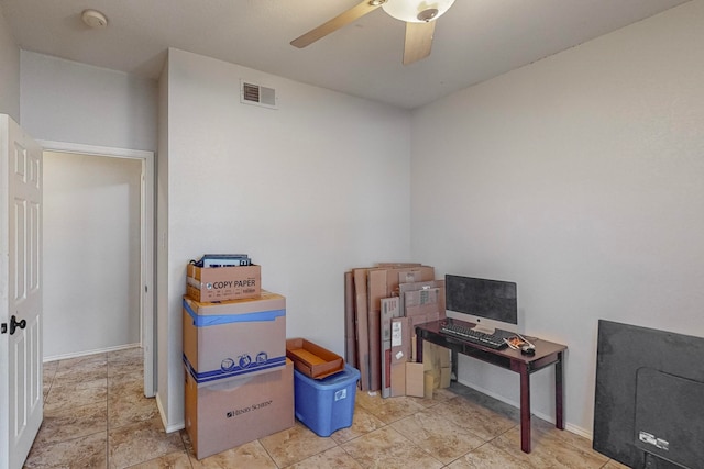 interior space with ceiling fan