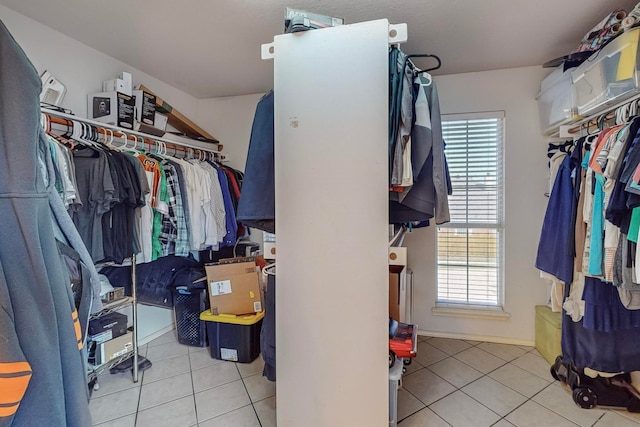 walk in closet featuring light tile patterned floors