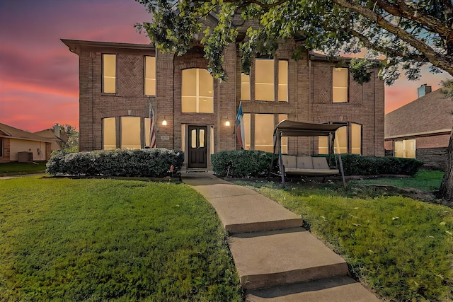 view of front of house with a yard