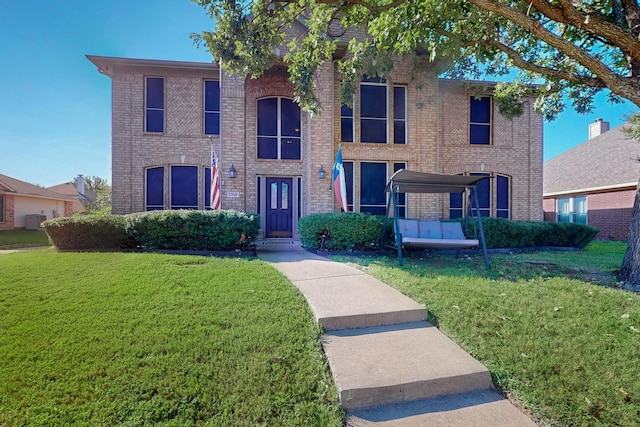 view of front of property featuring a front lawn