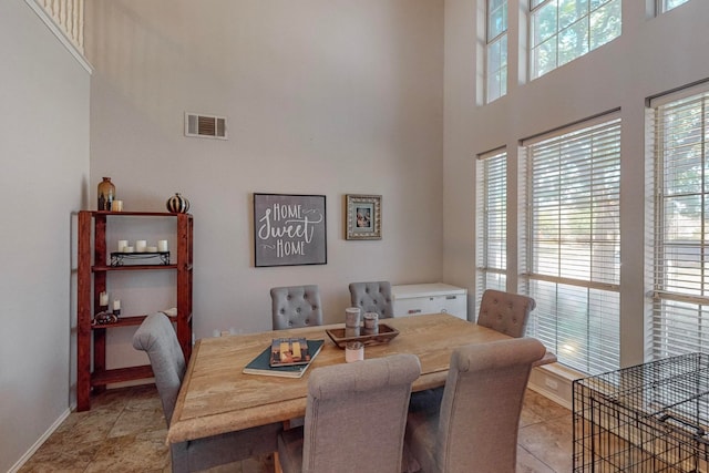 dining room with a high ceiling