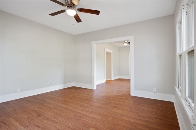 spare room featuring ceiling fan and light hardwood / wood-style floors