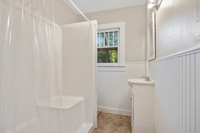 bathroom with vanity and curtained shower