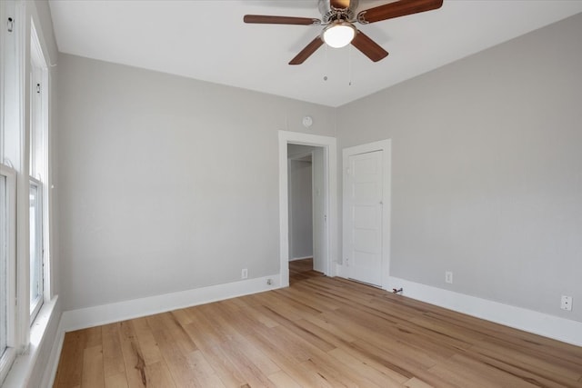 unfurnished room featuring light hardwood / wood-style floors and ceiling fan