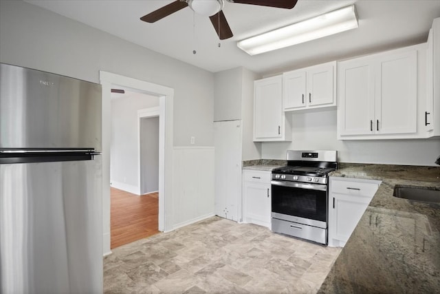 kitchen featuring sink, stainless steel appliances, and white cabinets