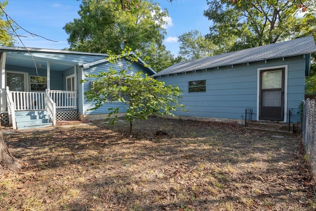 view of yard with covered porch