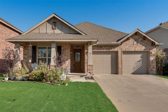 view of front of home featuring a garage and a front yard