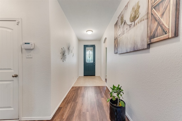 doorway to outside featuring wood-type flooring