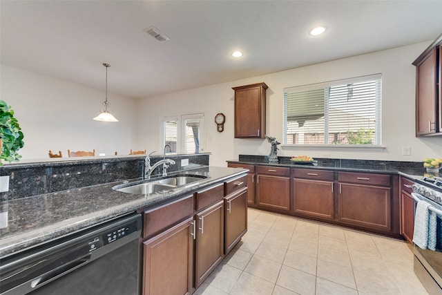 kitchen with sink, light tile patterned floors, stainless steel range oven, pendant lighting, and black dishwasher