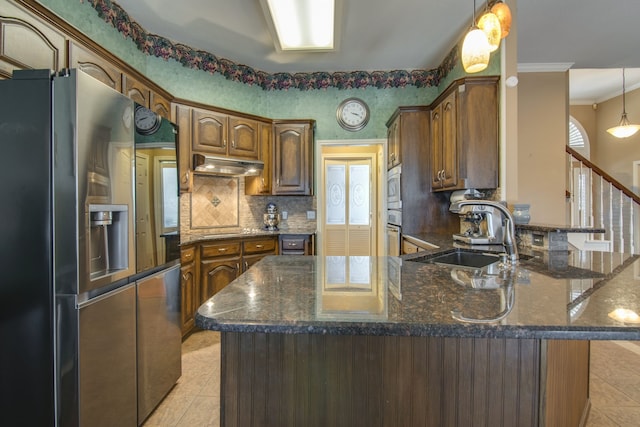 kitchen featuring stainless steel appliances, light tile patterned flooring, sink, and dark stone counters