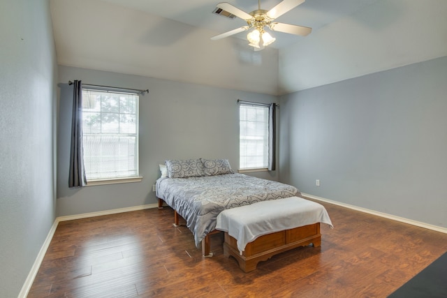 bedroom featuring lofted ceiling, dark hardwood / wood-style floors, and ceiling fan