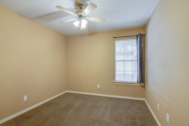 empty room with ceiling fan and carpet