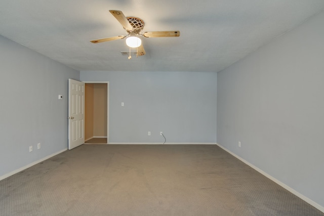 empty room with carpet floors and ceiling fan