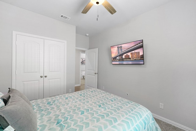 bedroom with a closet, ceiling fan, and carpet