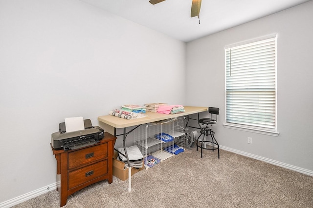 office with a ceiling fan, light colored carpet, and baseboards