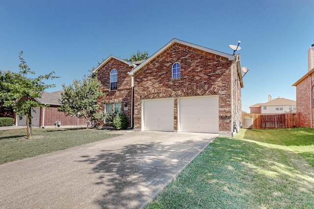 front facade with a front yard and a garage