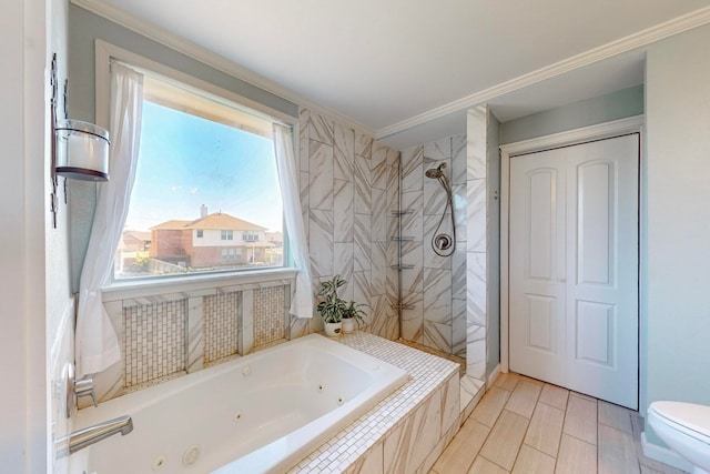 bathroom featuring toilet, ornamental molding, and separate shower and tub