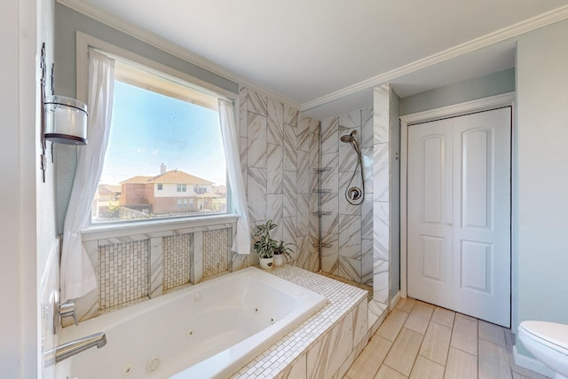 bathroom with ornamental molding, shower with separate bathtub, and toilet