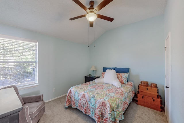 carpeted bedroom featuring ceiling fan and lofted ceiling