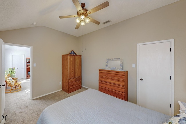 carpeted bedroom featuring lofted ceiling and ceiling fan