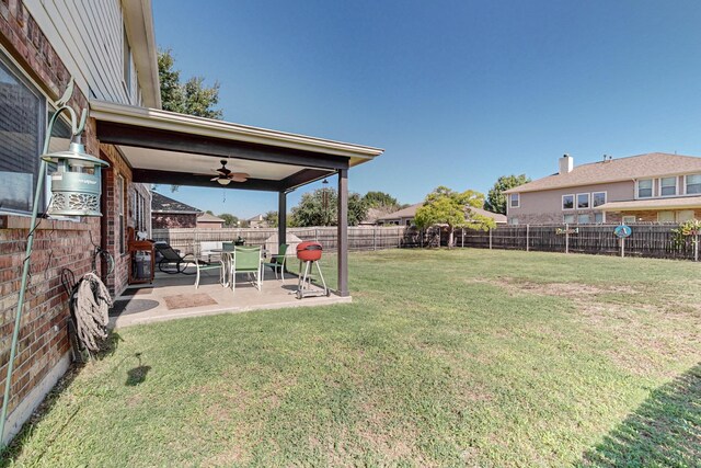 rear view of house featuring a patio area and a lawn