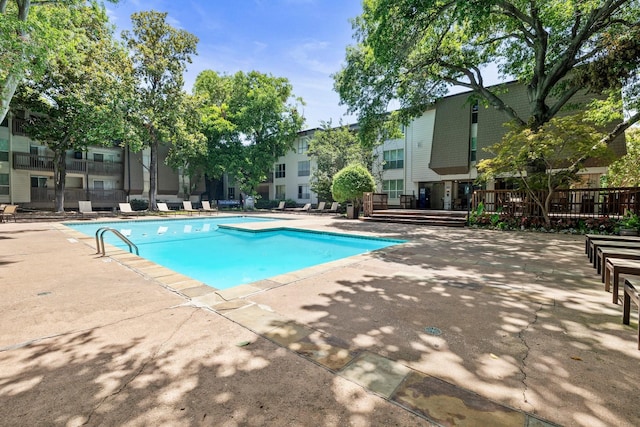 view of swimming pool with a patio area