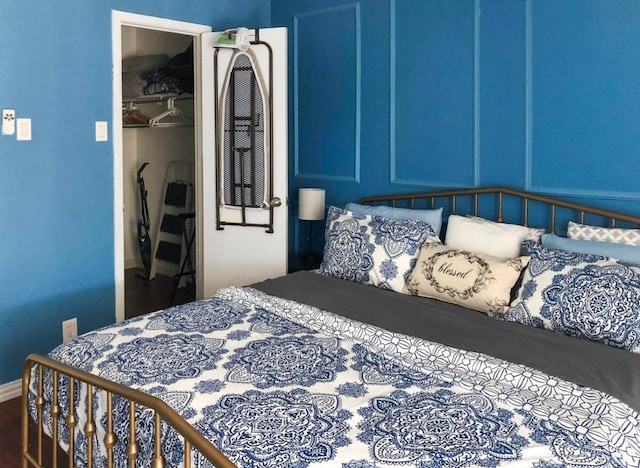 bedroom featuring hardwood / wood-style flooring and a closet