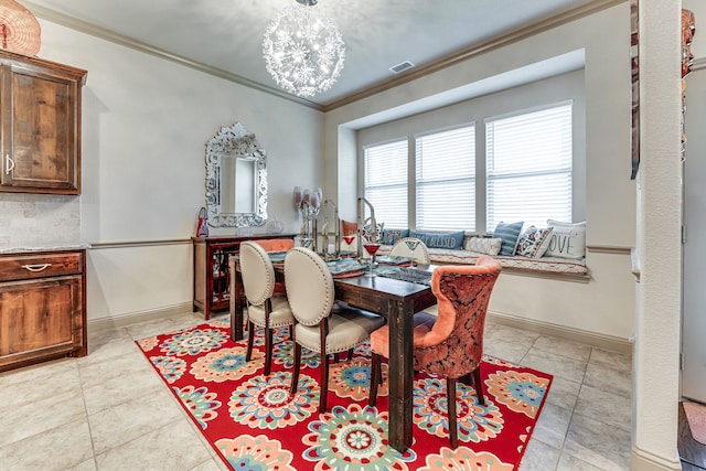dining room featuring ornamental molding, visible vents, light tile patterned floors, and a chandelier