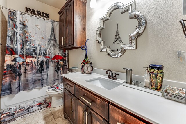 bathroom with toilet, vanity, tile patterned flooring, and shower / tub combo with curtain