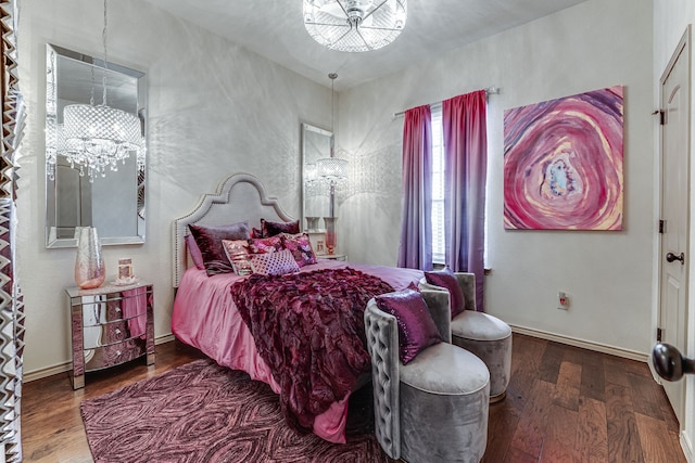 bedroom featuring an inviting chandelier and wood-type flooring