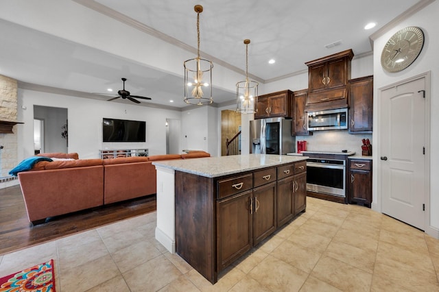 kitchen featuring appliances with stainless steel finishes, pendant lighting, crown molding, and dark brown cabinetry