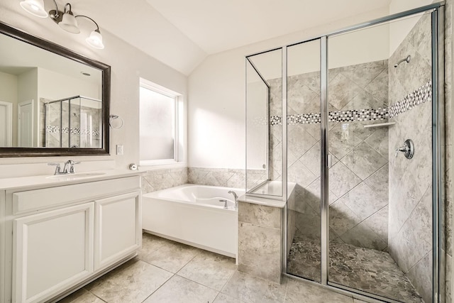 bathroom with tile patterned flooring, vanity, vaulted ceiling, and separate shower and tub