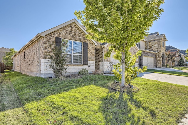 view of front of house featuring a garage and a front lawn