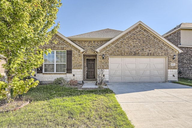 view of front of home with a front yard and a garage