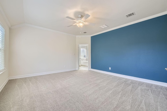 spare room with carpet, lofted ceiling, ceiling fan, and ornamental molding